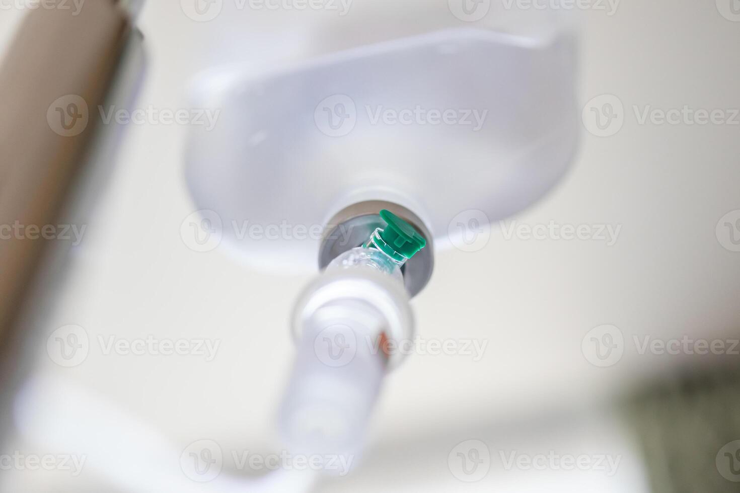 Close up medical intravenous IV drip in hospital background photo