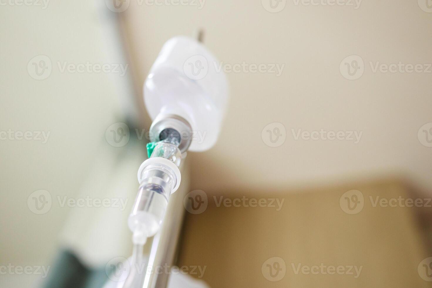 Close up medical intravenous IV drip in hospital background photo