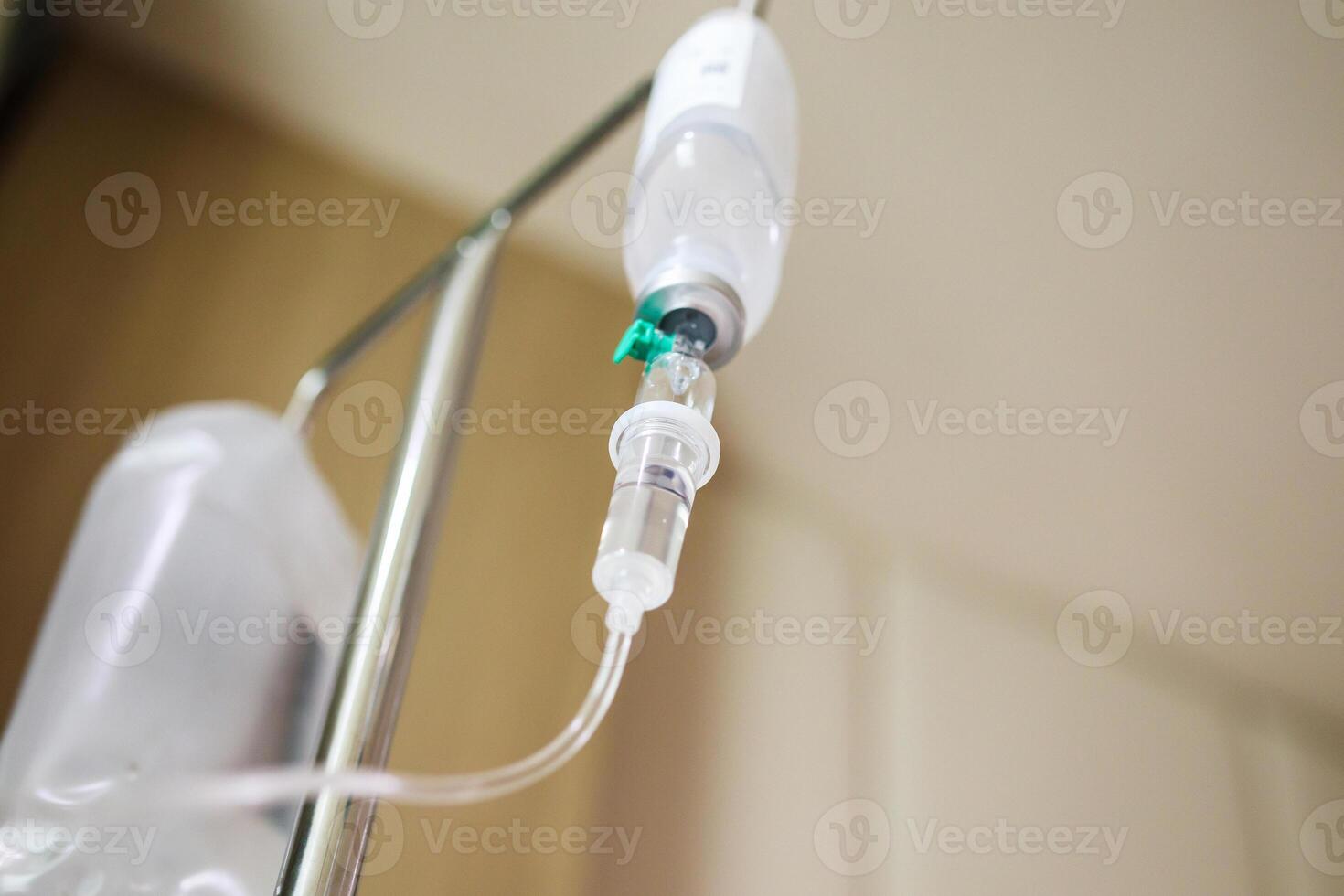 Close up medical intravenous IV drip in hospital background photo
