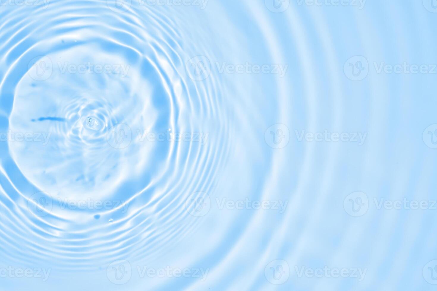 Abstract transparent water shadow surface texture natural ripple on blue background photo