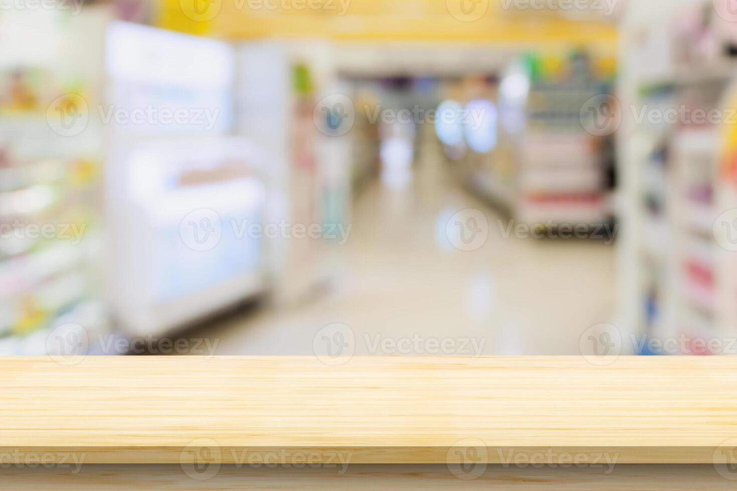 Empty wood table top with supermarket blurred background for product display photo