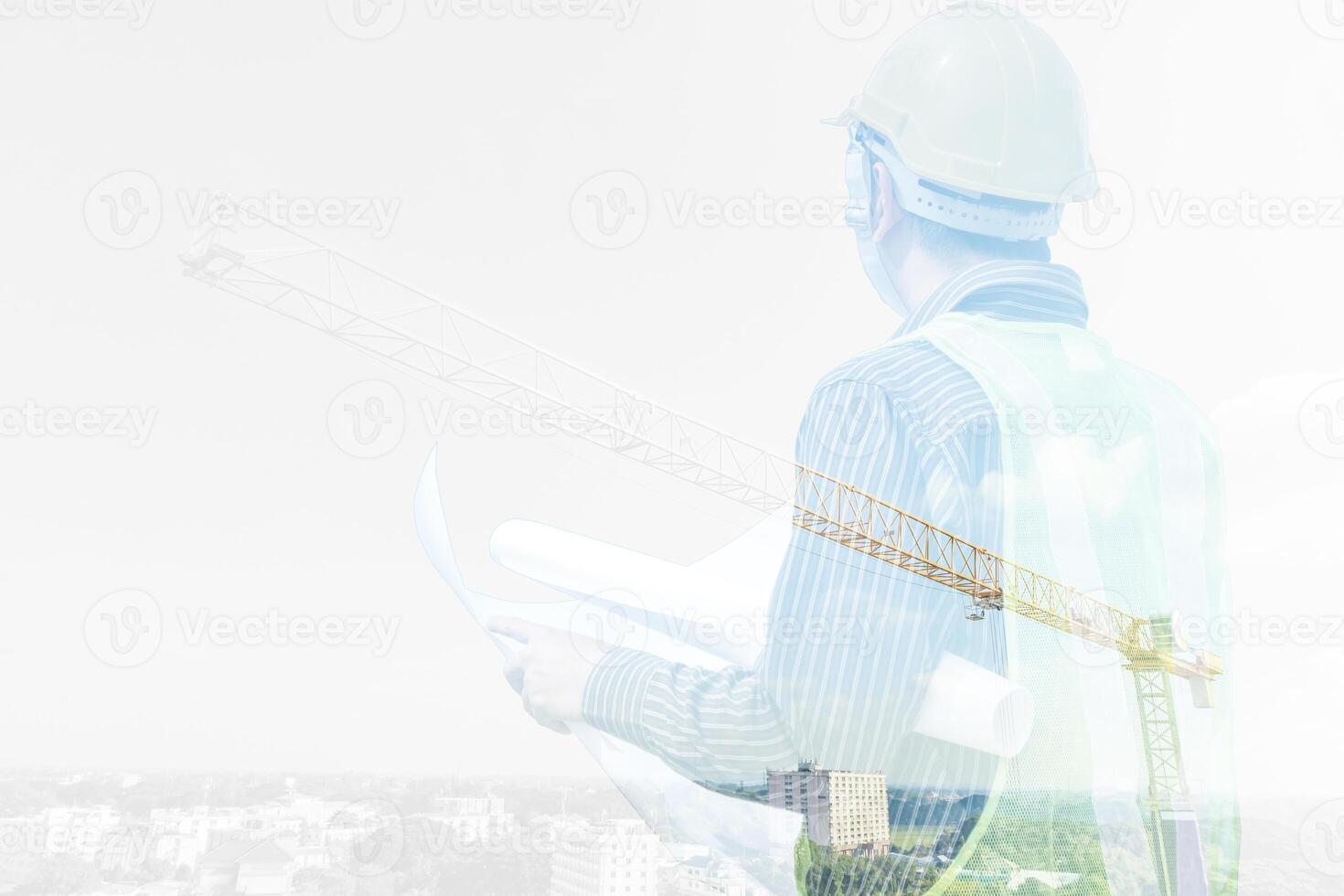 Double exposure image of professional engineer in protective helmet and blueprints paper at building construction site photo