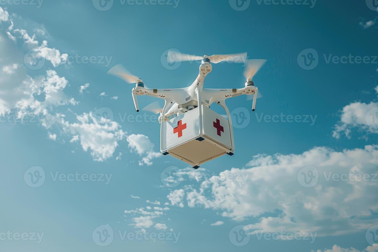 A drone carrying a medical package with a red cross symbol against a sky background. photo