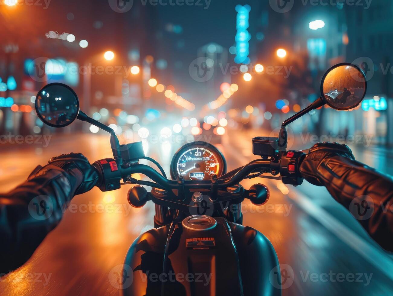 A rider's perspective on a motorcycle navigating through a bustling city street at night photo