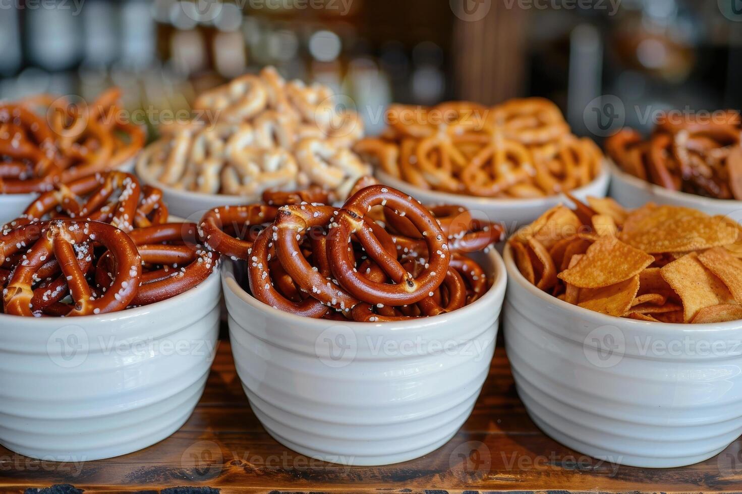 Salty snacks such as pretzels, chips, and crackers photo