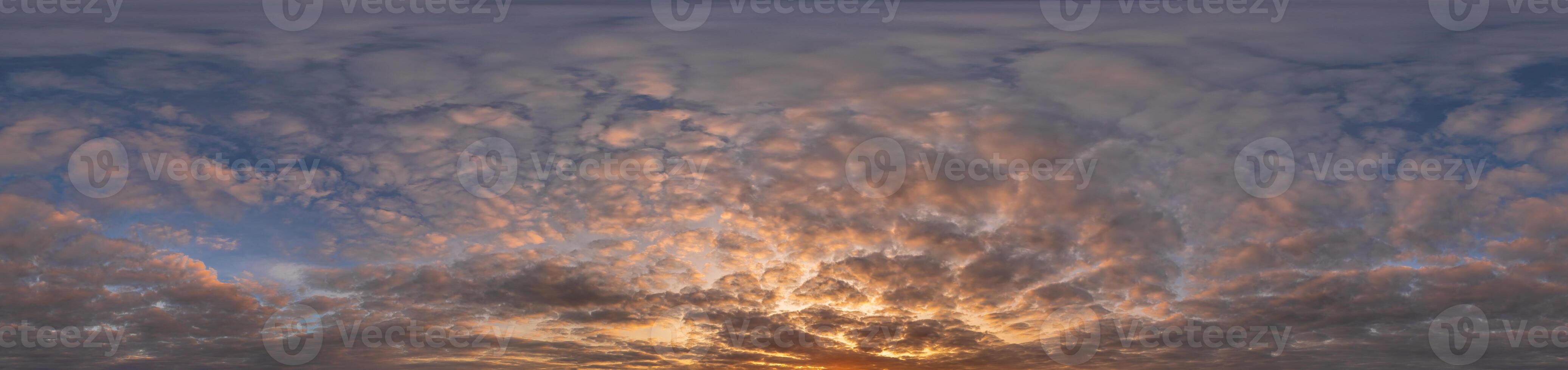 Golden sunset sky panorama Seamless spherical equirectangular 360-degree view with beautiful Stratocumulus clouds setting sun - for use in 3D graphics as a sky dome or post-processing of drone images photo