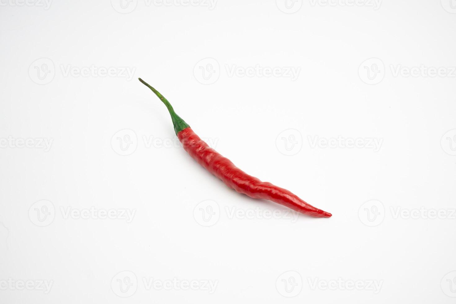 Single large red chili. typical Indonesian, isolated on a white background. photo