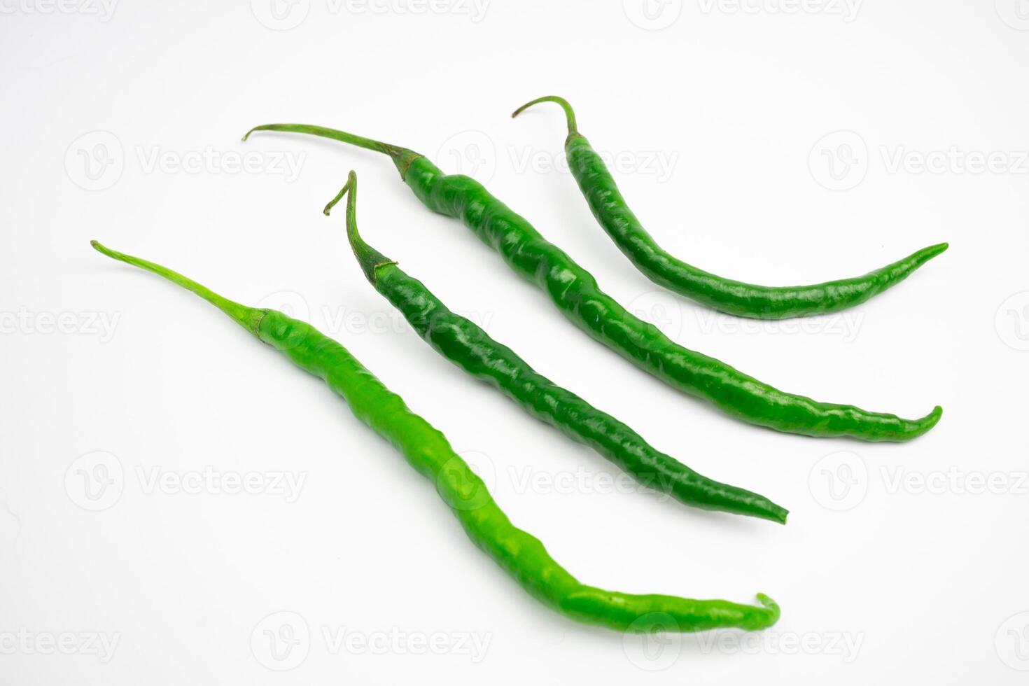 Curly green chilies in clusters. typical Indonesian. isolated on white background. photo