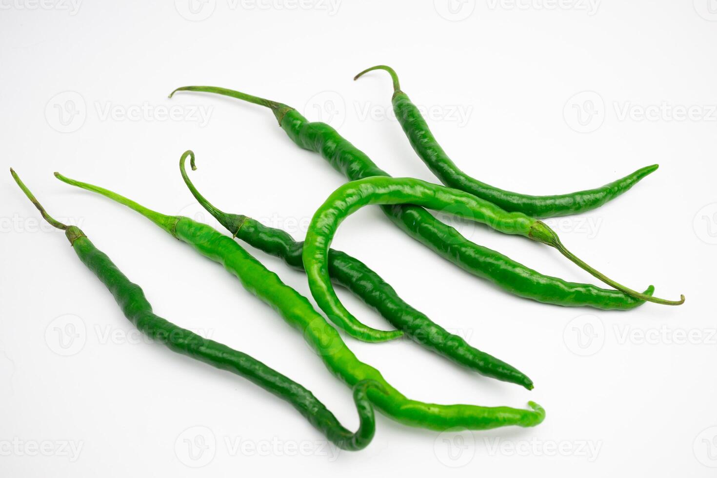 Curly green chilies in clusters. typical Indonesian. isolated on white background. photo