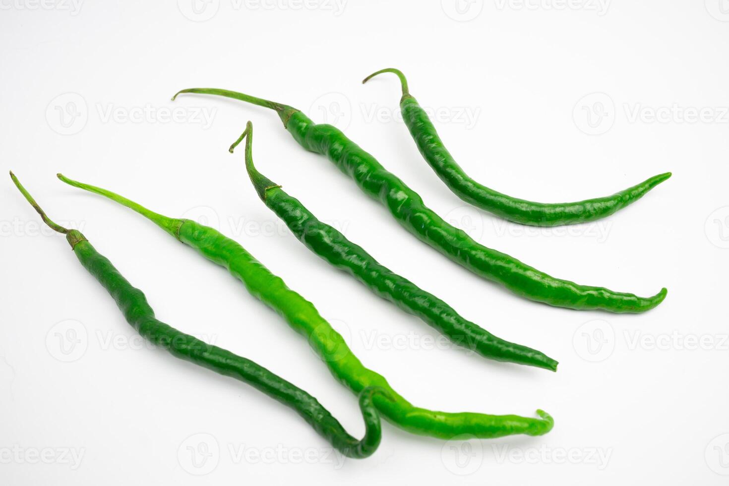 Curly green chilies in clusters. typical Indonesian. isolated on white background. photo
