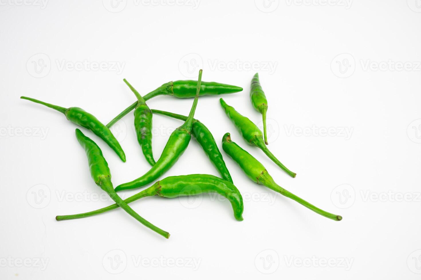 Green cayenne peppers in clusters. isolated on white background. photo