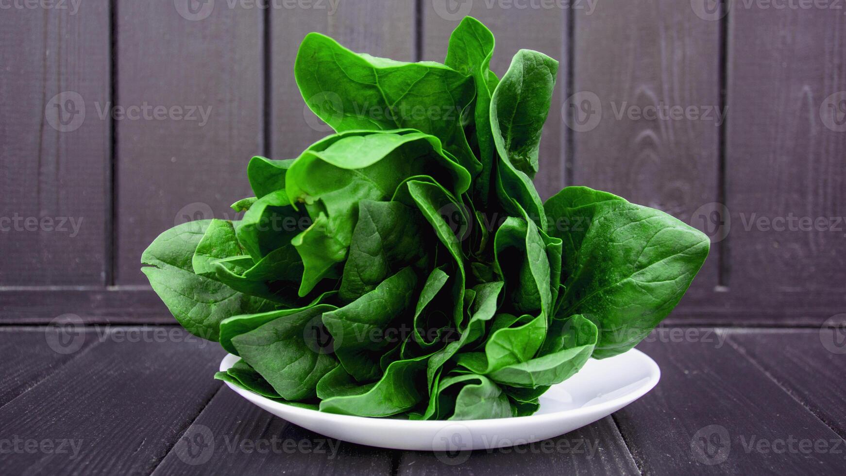 A bunch of fresh aromatic spinach greens on a beautiful background photo