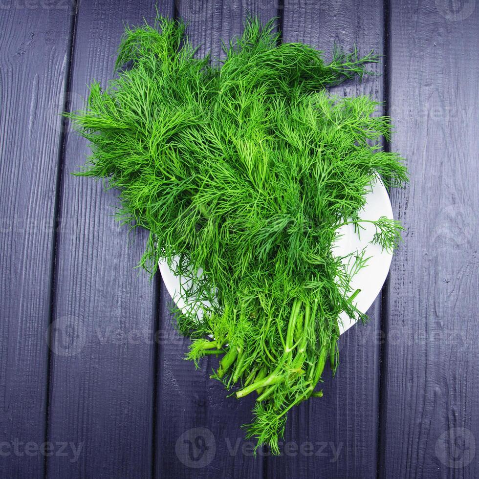 A bunch of fresh aromatic dill greens on a beautiful background photo