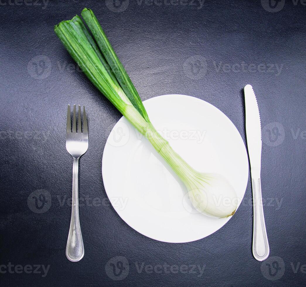 A bunch of fresh aromatic onions on a beautiful background photo