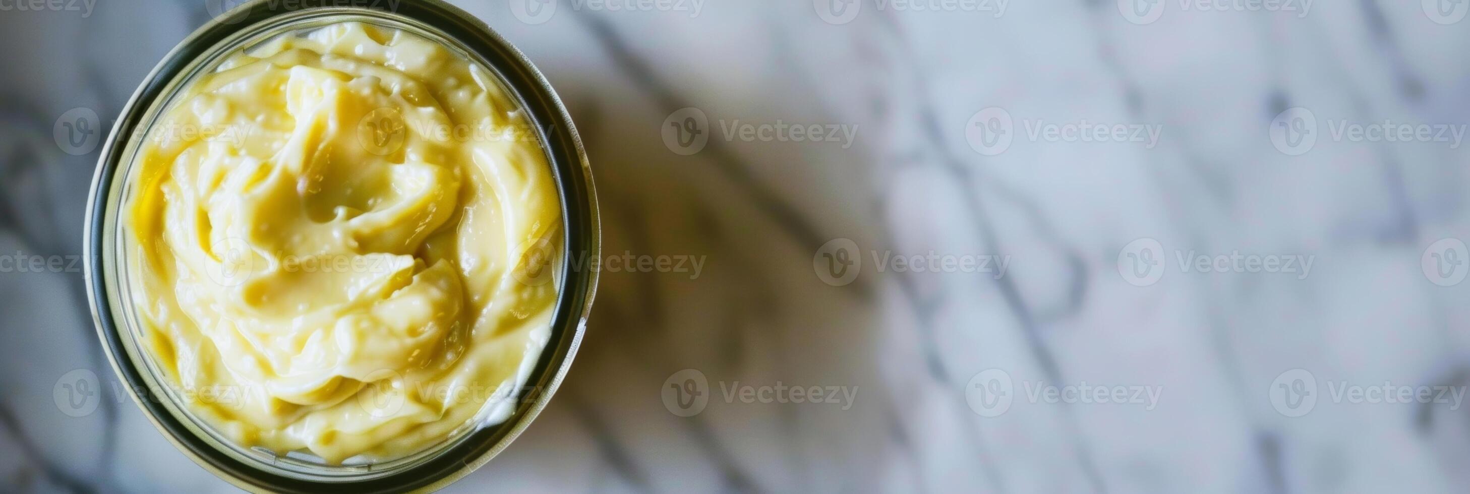 A jar of homemade avocado oil mayo contrasting it with traditional storebought mayo and promoting it as a healthier alternative photo