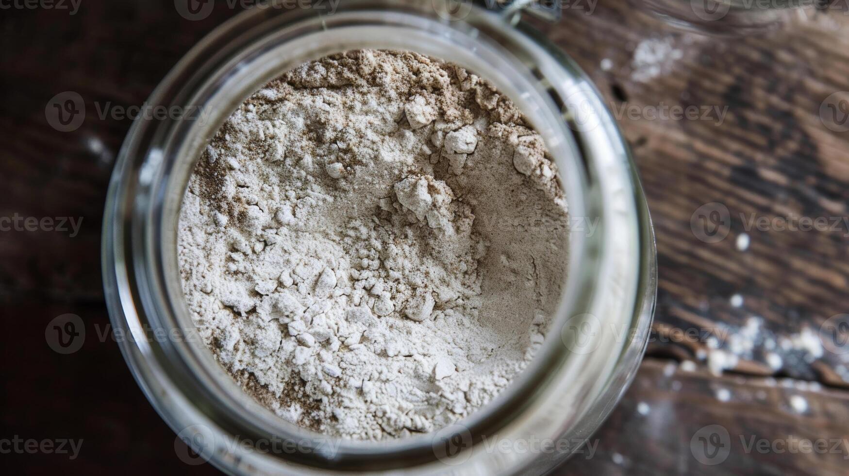 A jar of buckwheat flour with a delicate layer of dust on top a reminder that this humble grain has the power to nourish and delight in so many ways photo