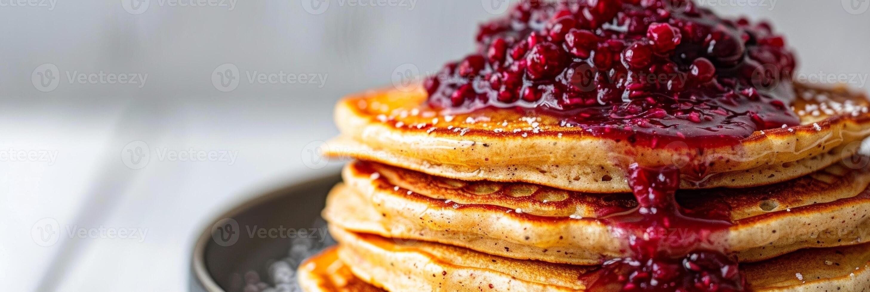 A stack of fluffy pancakes made with oat flour and topped with a dollop of homemade berry compote. A guiltfree breakfast option with minimal carbon footprint photo