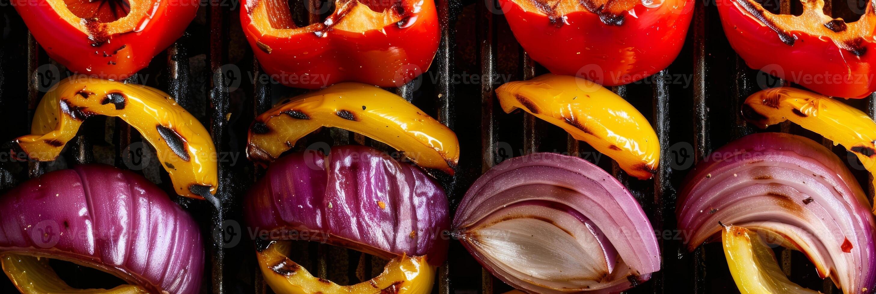 Thinly sliced bell peppers and onions grilling to perfection adding a pop of color to any meal photo