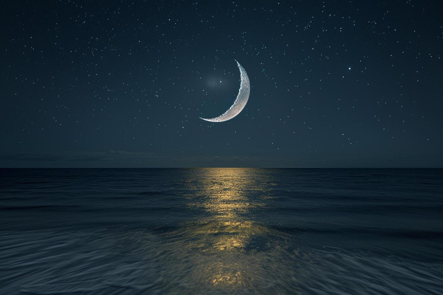Moon and Crescent over Ocean at Night Background photo