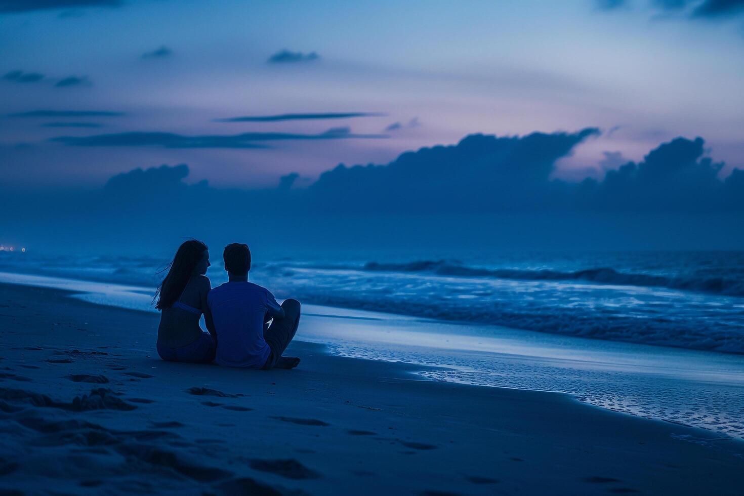 Couple Sitting on the Beach at Dusk, Romantic Background photo