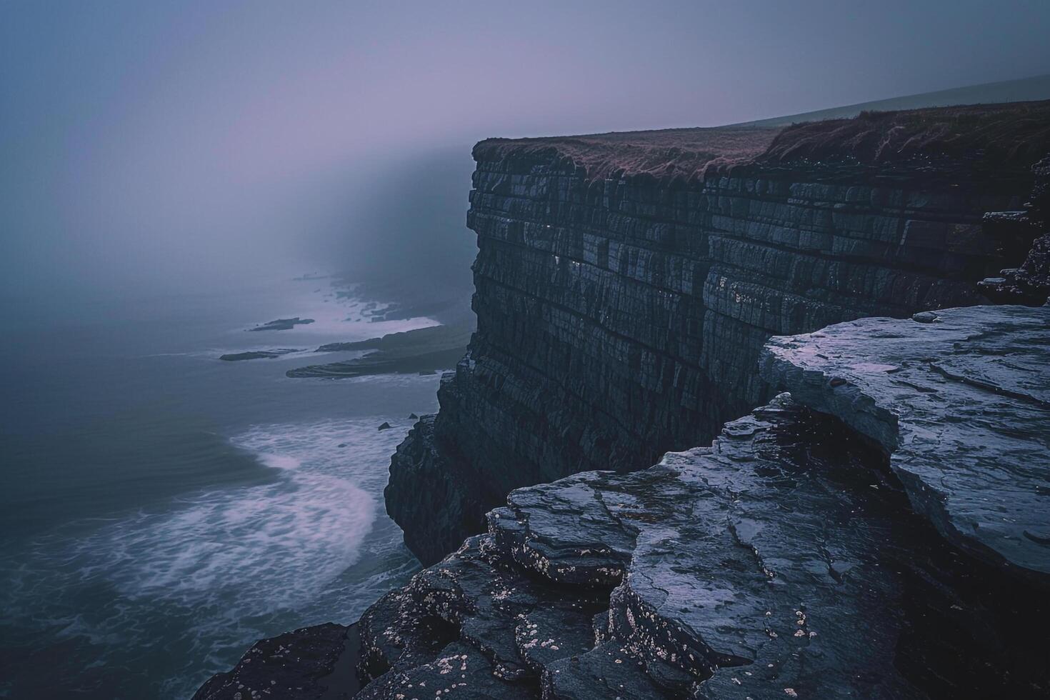 A Cliff with a Dark Ocean and a Person Standing on the Edge, Background of a Cliff with a Dark Ocean and a Person Standing on the Edge photo