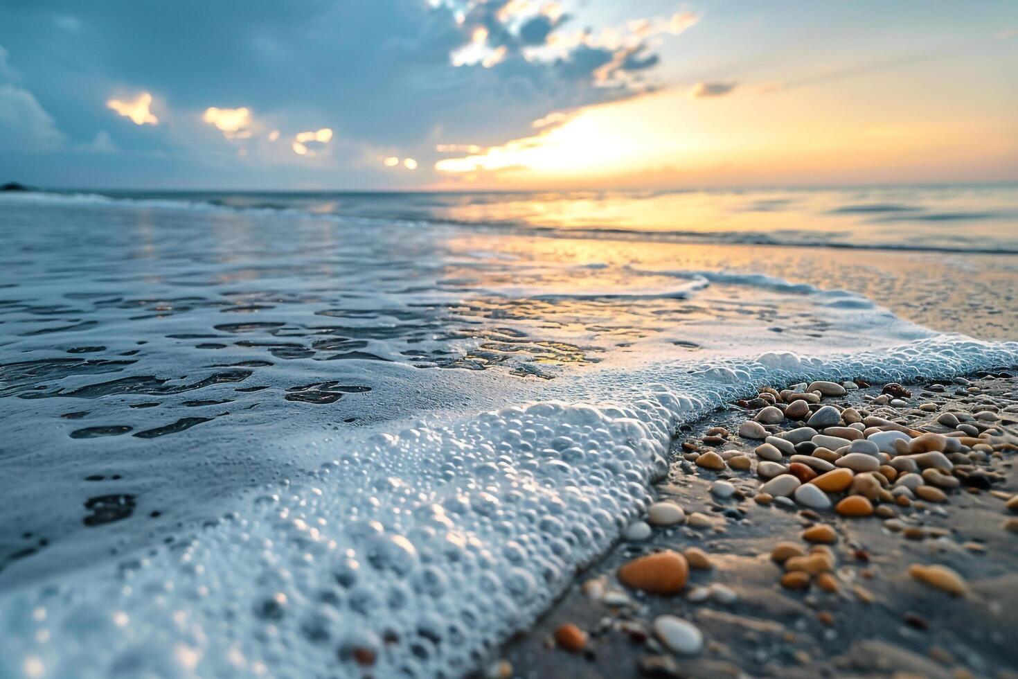 A Beach with Waves and Shells at Sunset photo