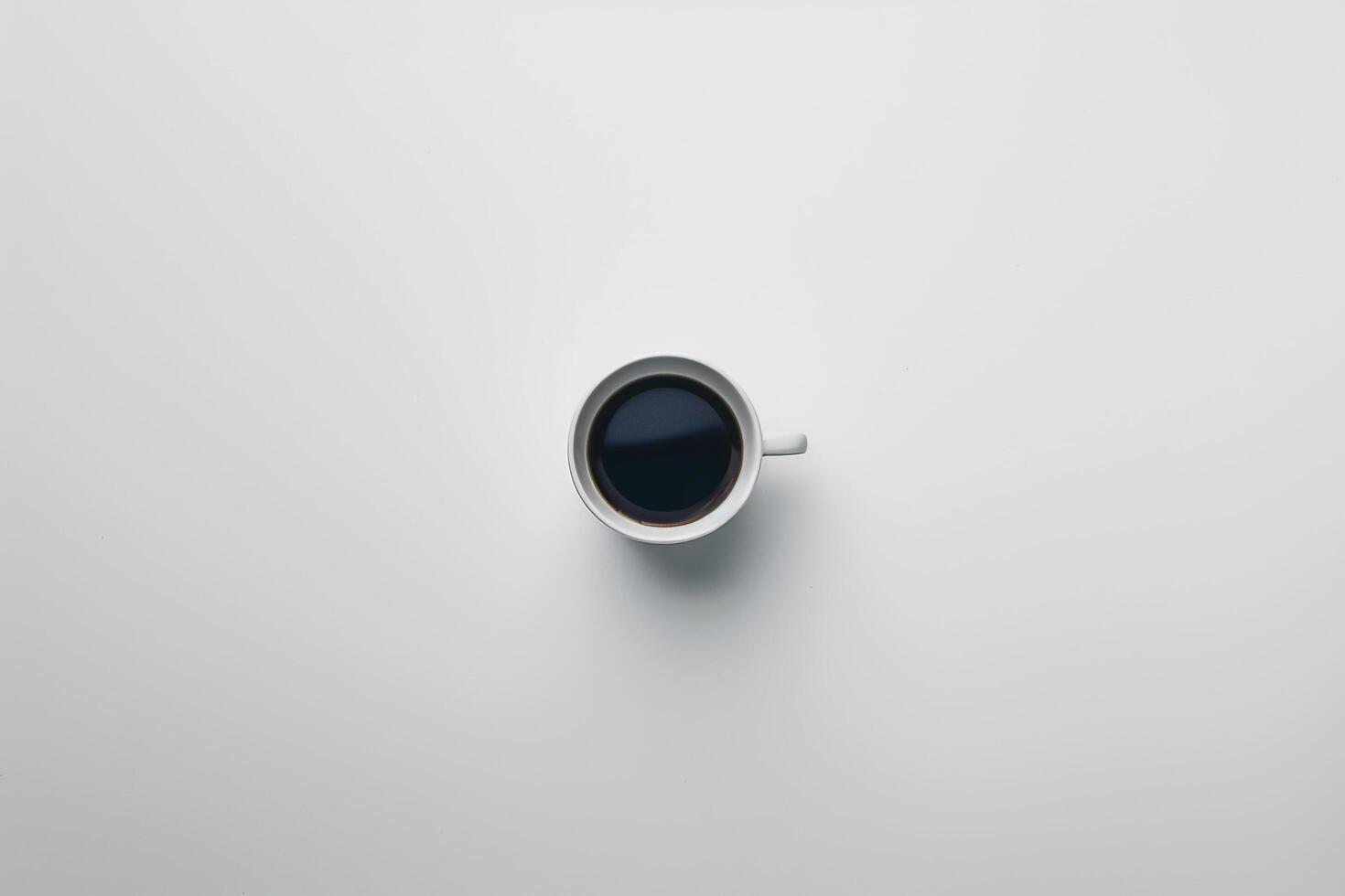 Cup of Coffee on White Surface Background photo