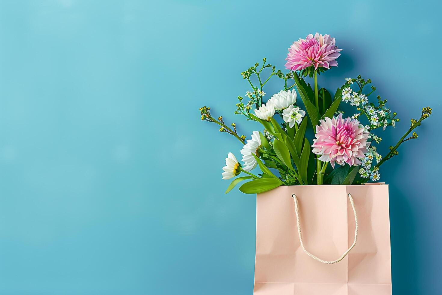 flowers in a paper bag on blue background photo