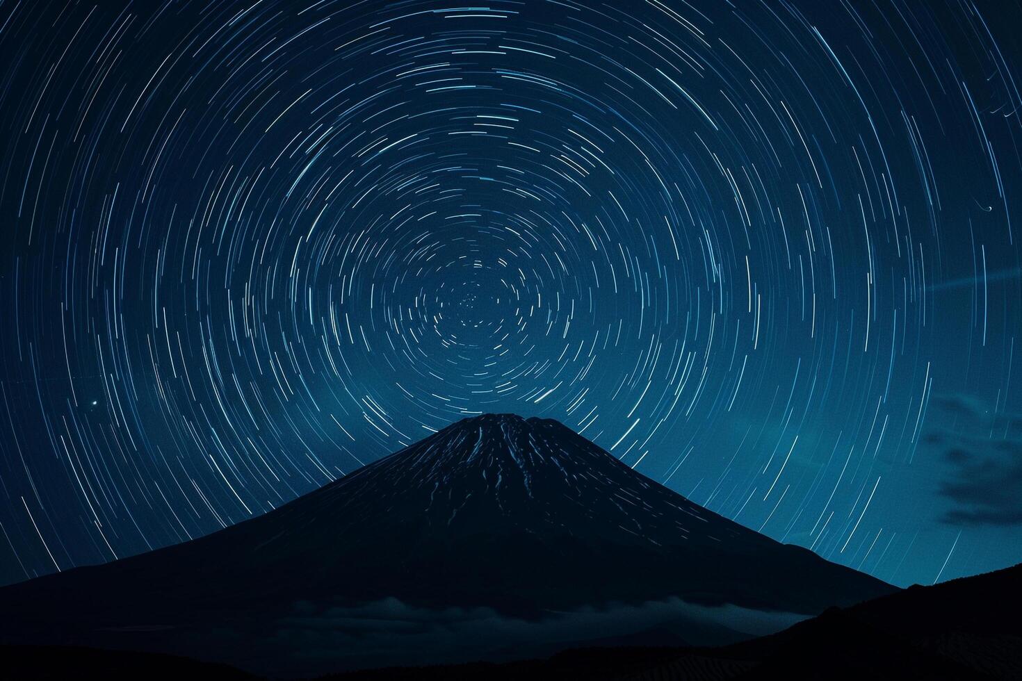 mount fuji star trails over the mountain background photo