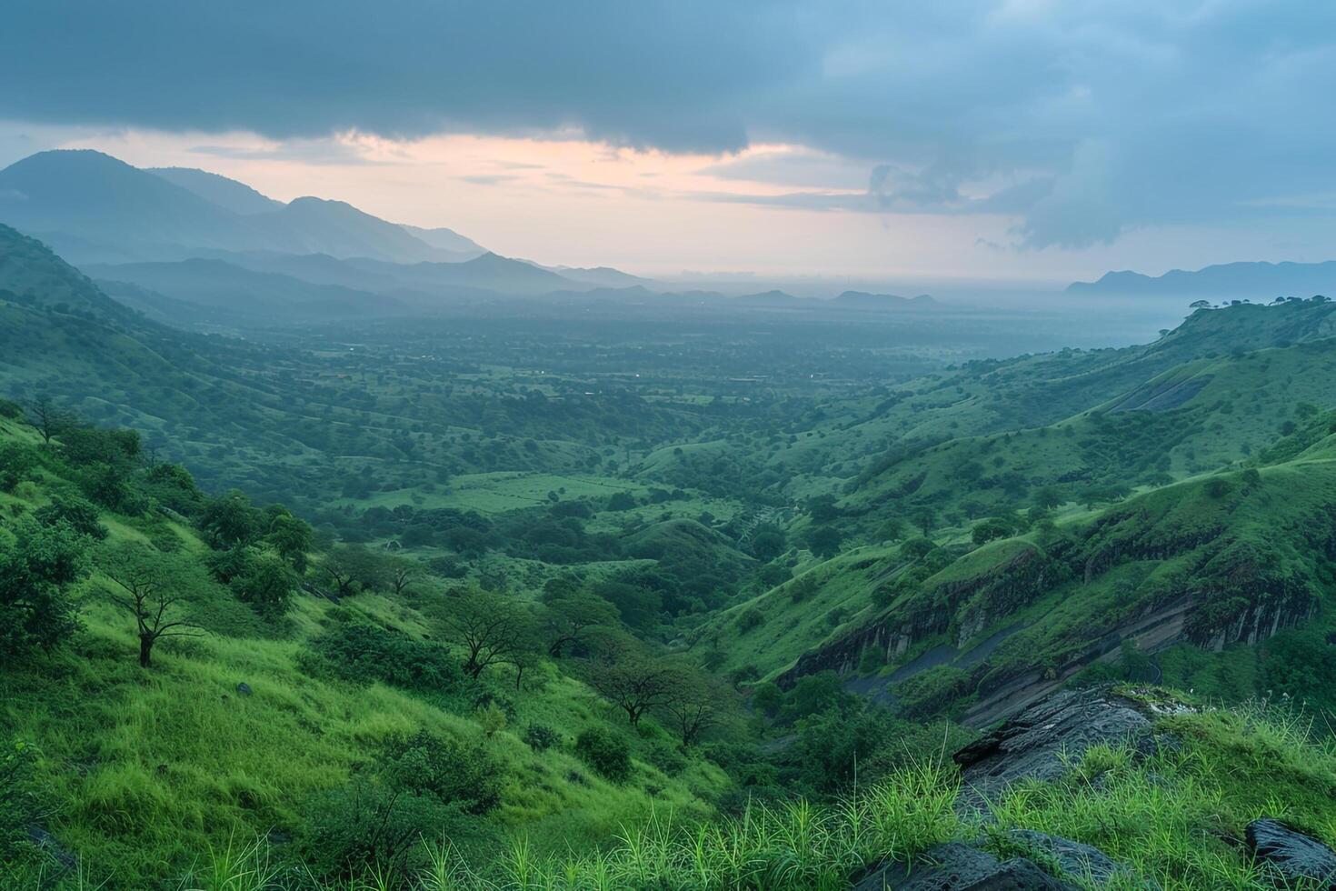 a view of the mountains and green hills at sunset background photo