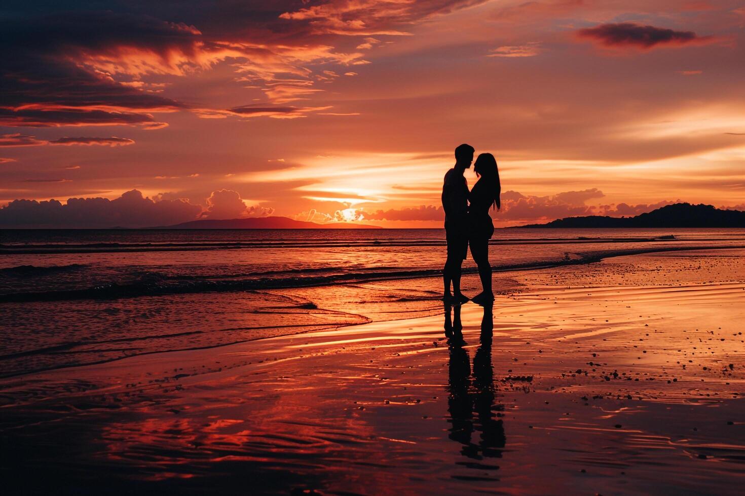 a couple standing on the beach at sunset with a nature background photo
