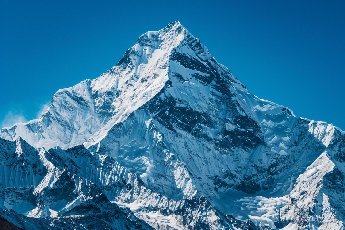 a large mountain peak with snow on it and a nature background photo