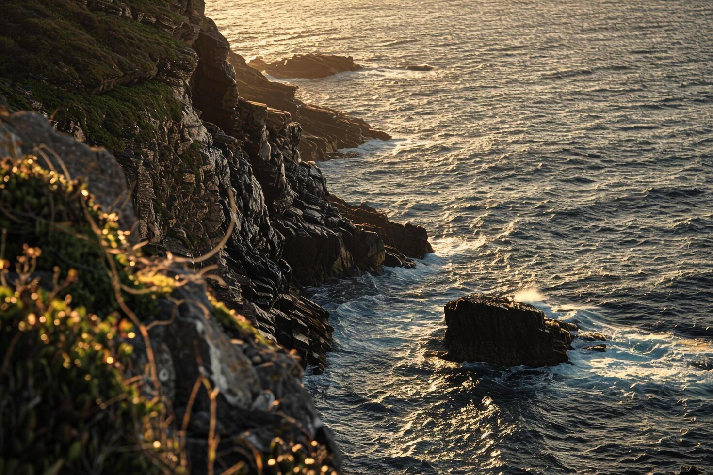 A person standing on a cliff overlooking the ocean background photo