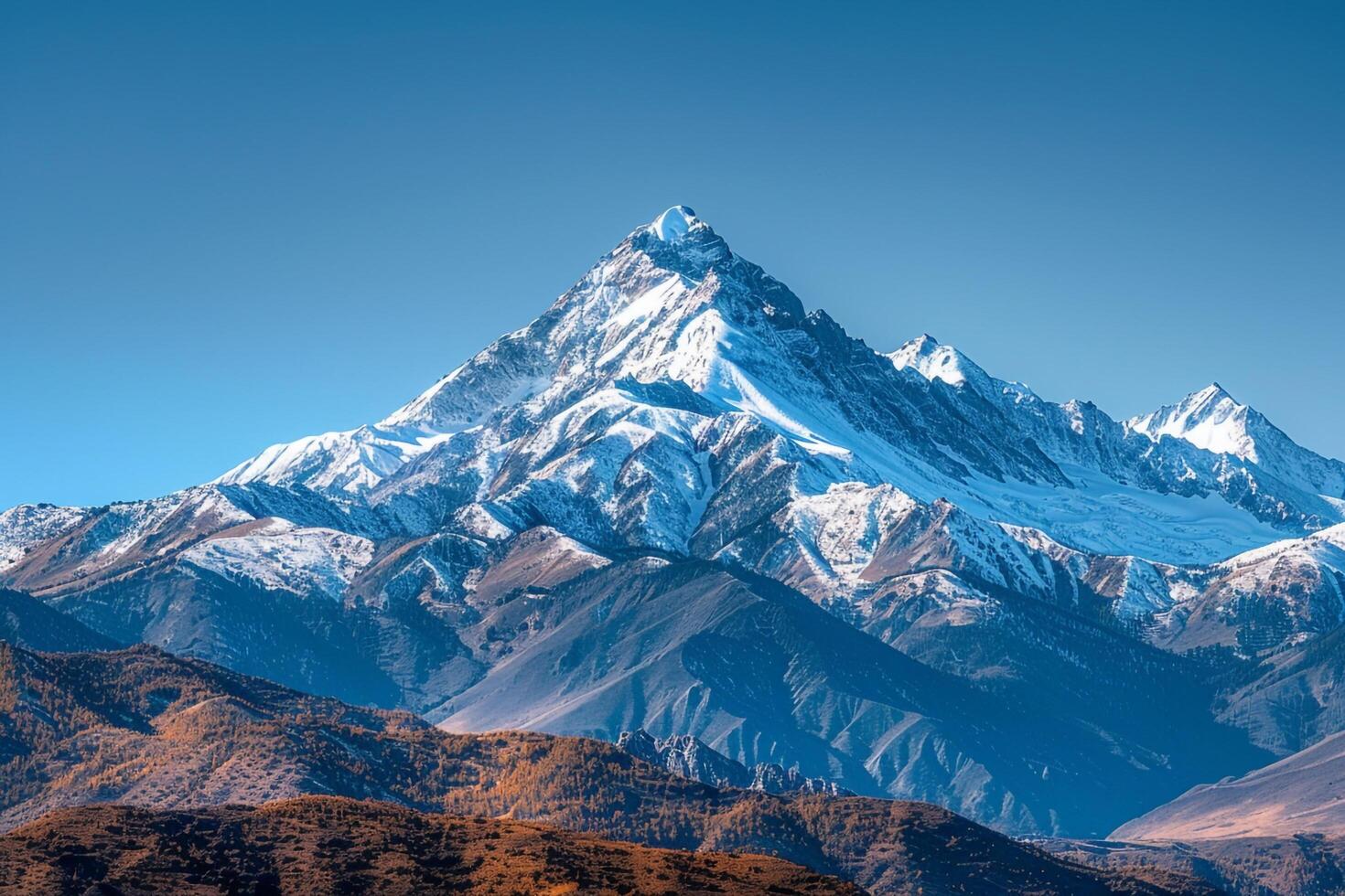 a mountain peak with snow on it background photo