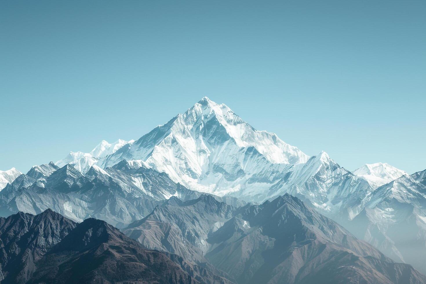 a mountain range with snow capped peaks background photo