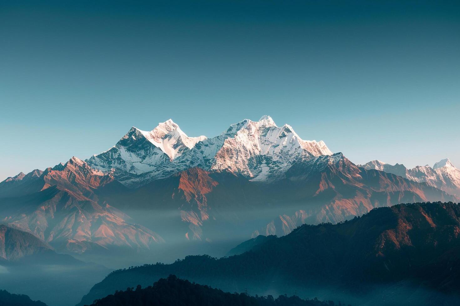 the mountains are covered in snow and fog background photo
