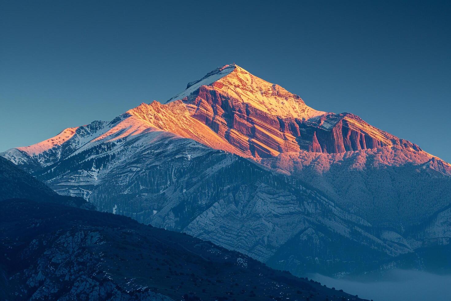 a mountain with a snowcovered peak background photo