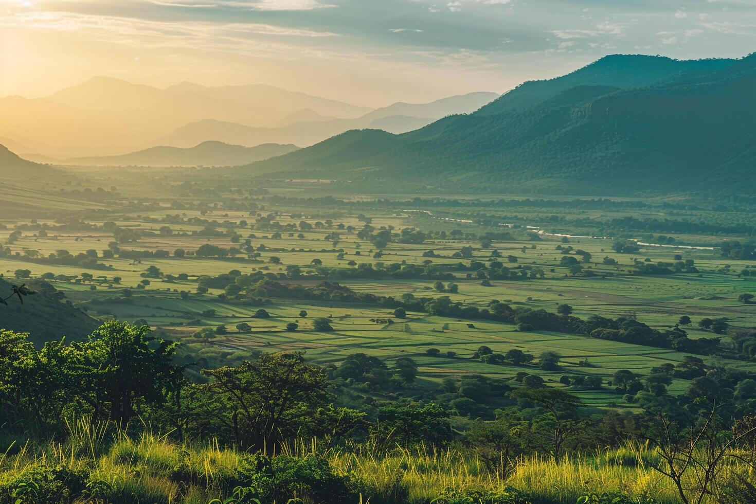 a beautiful view of a valley and mountains at sunset background photo