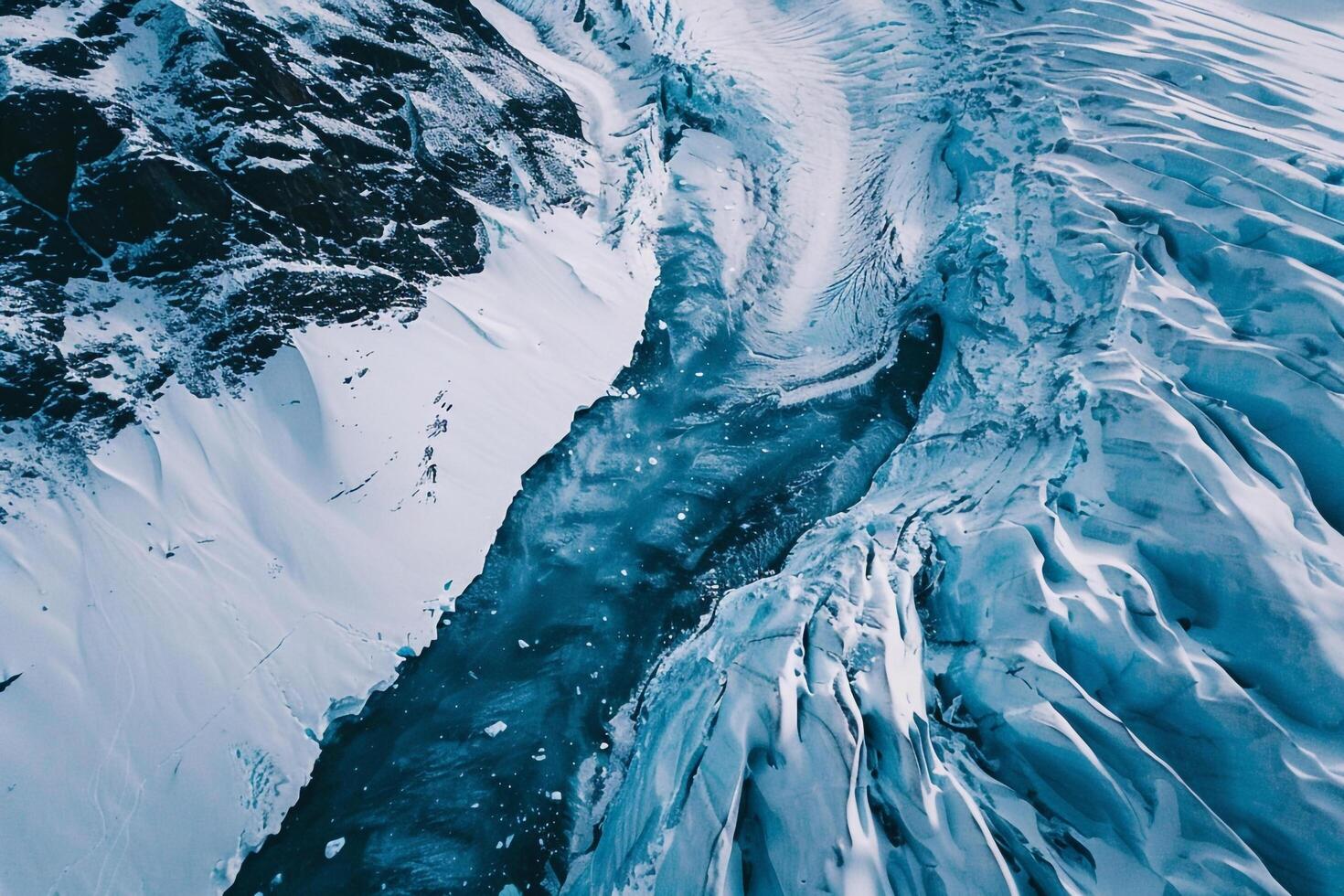 An Aerial View of a Glacier with Ice and Snow with a Scenic Background photo