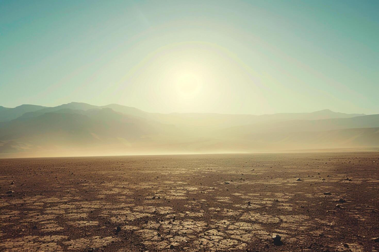 A Desert Landscape with the Sun Shining in the Distance with a Scenic Background photo