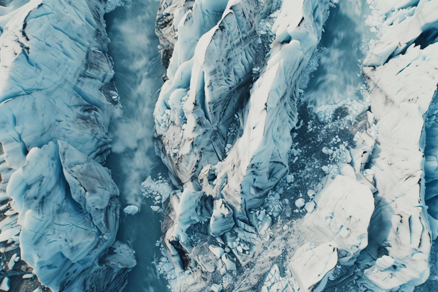 an aerial view of a glacier with ice and water background photo