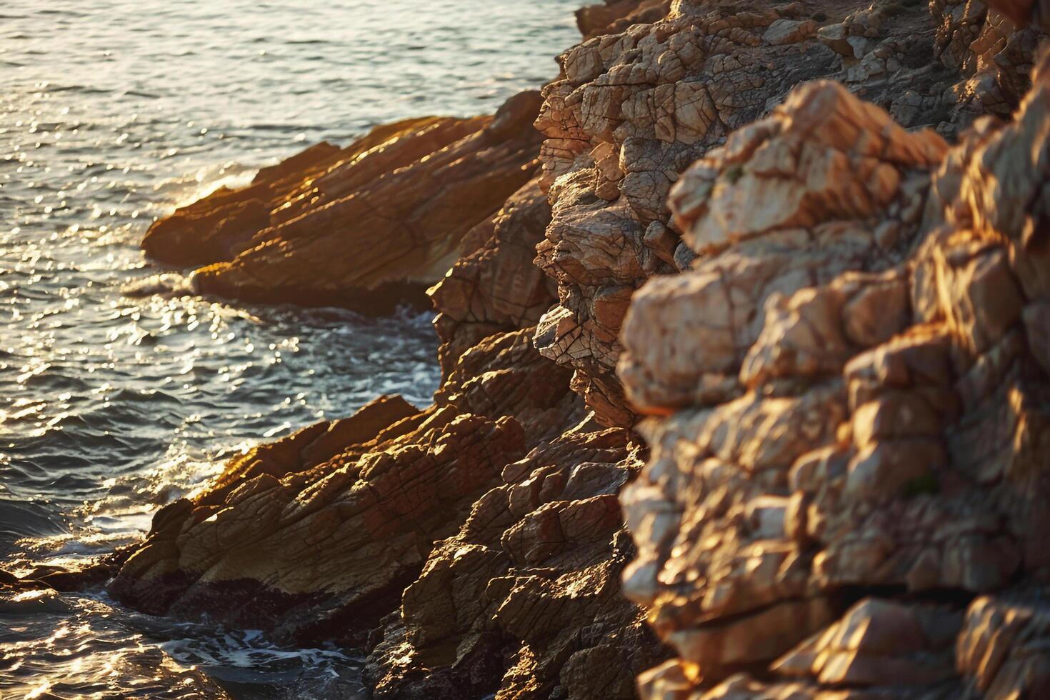 a person standing on a rocky cliff overlooking the ocean with background photo
