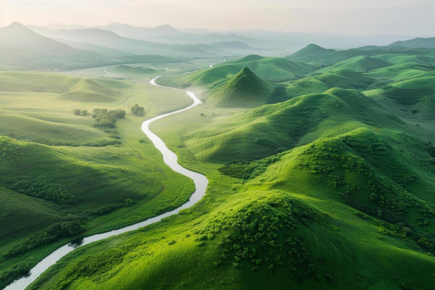 An aerial view of a river flowing through green hills background photo