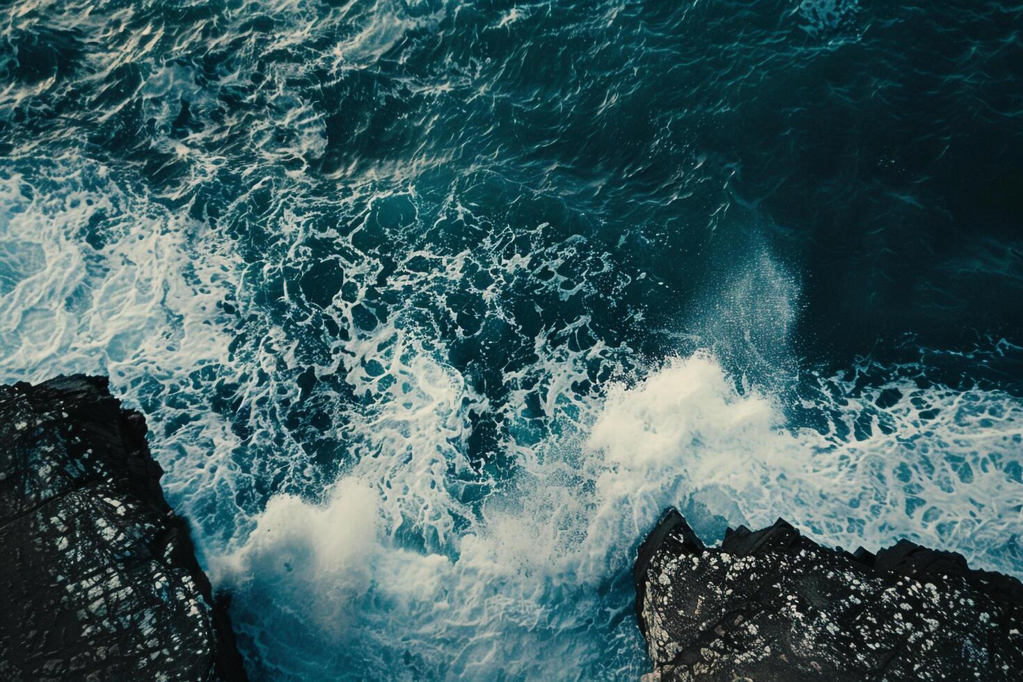 an aerial view of the ocean and waves background photo