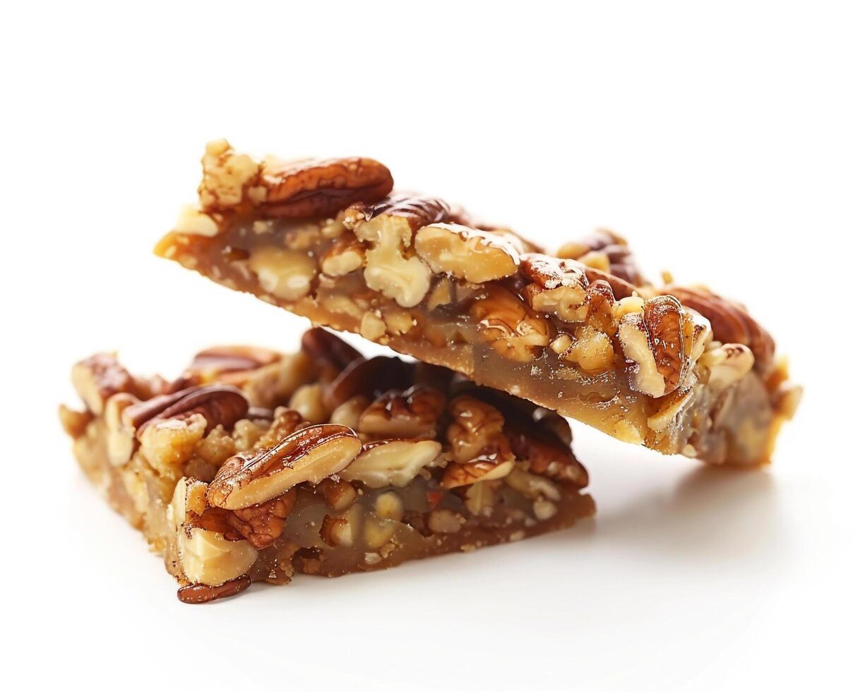 two pieces of pecan pie bars on a white background background photo