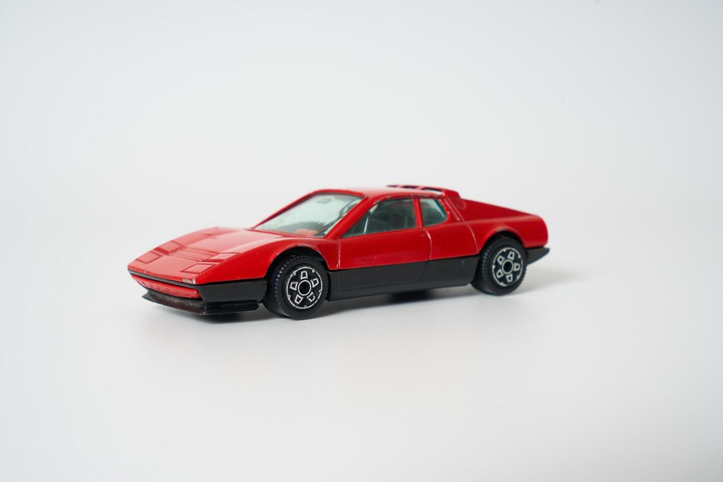 a red toy sports car on a white background photo