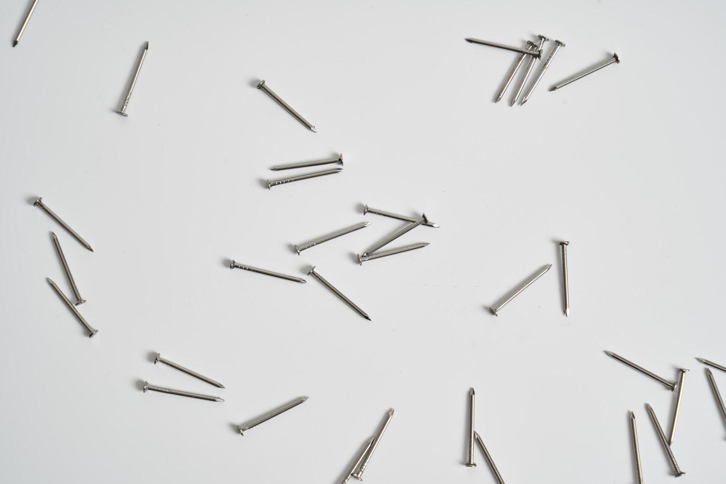 Wood nails on a white background photo