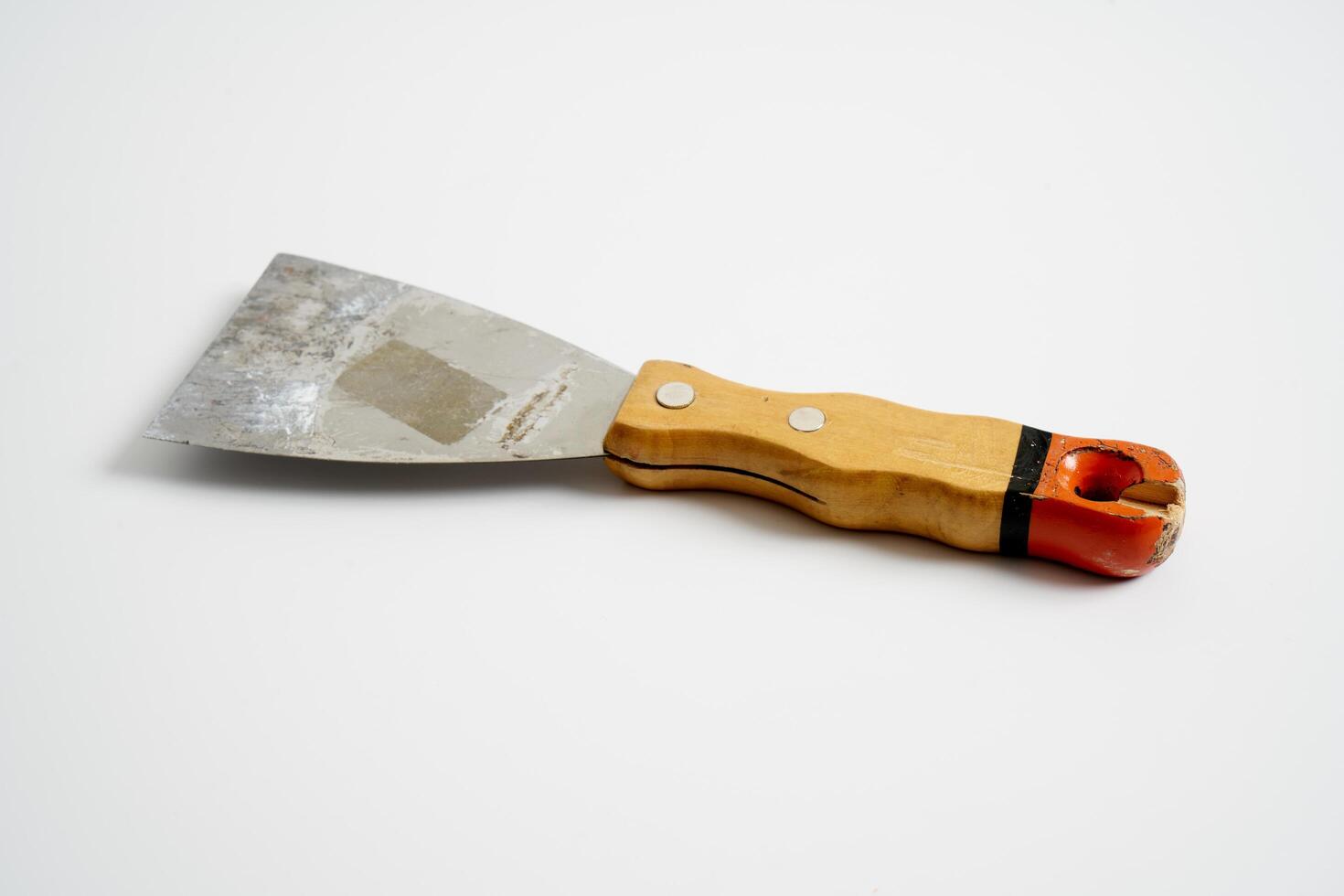 construction spatula with wooden handle photo
