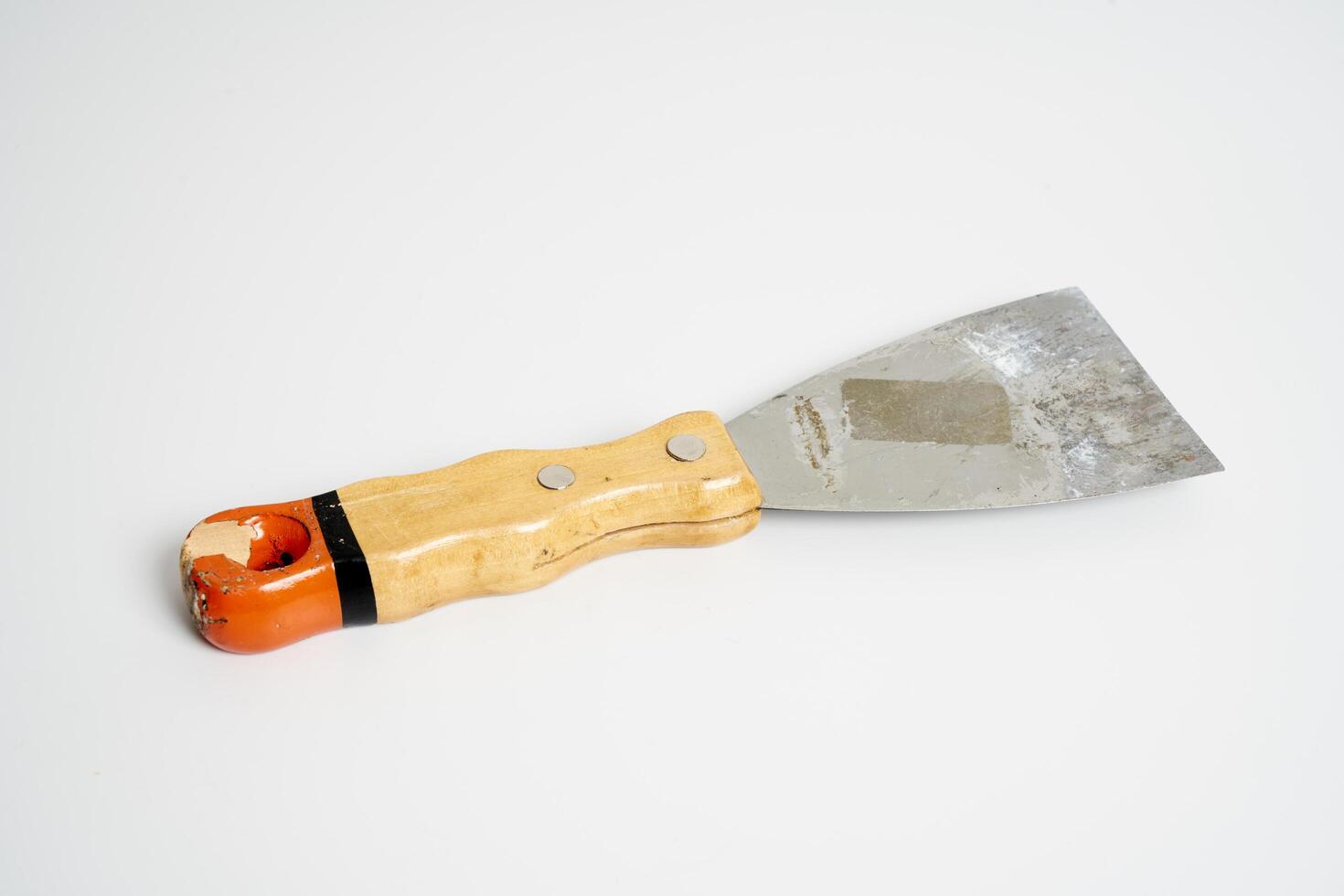 construction spatula with wooden handle photo