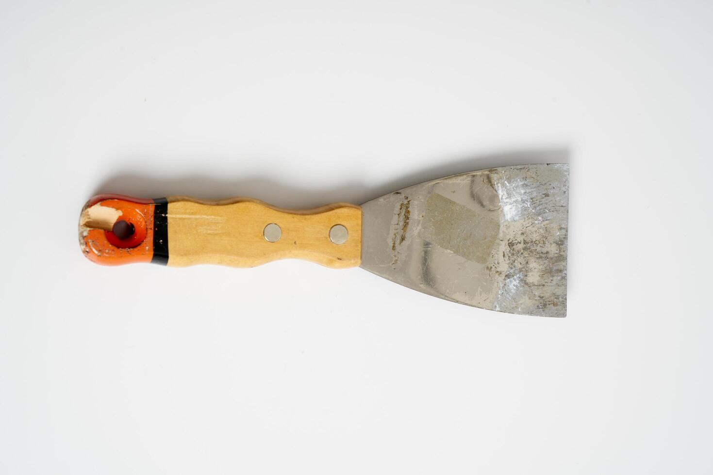 construction spatula with wooden handle photo